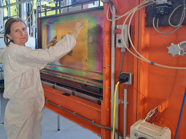 Sophie Gledhill at the load-lock on the vertical inline plasma pilot line.